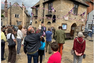 Blue Plaque unveiling ceremony  - A group of people standing around Eynsham Market Square - Photographer Katherine Doughty