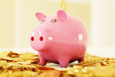 Improving Eynsham survey - pink piggy bank standing on gold coins - Photographer Brano Unsplash
