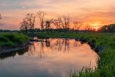 Waterways Day 2023 - a wide river meandering across a field as sunset - Photographer Dave Hoefler